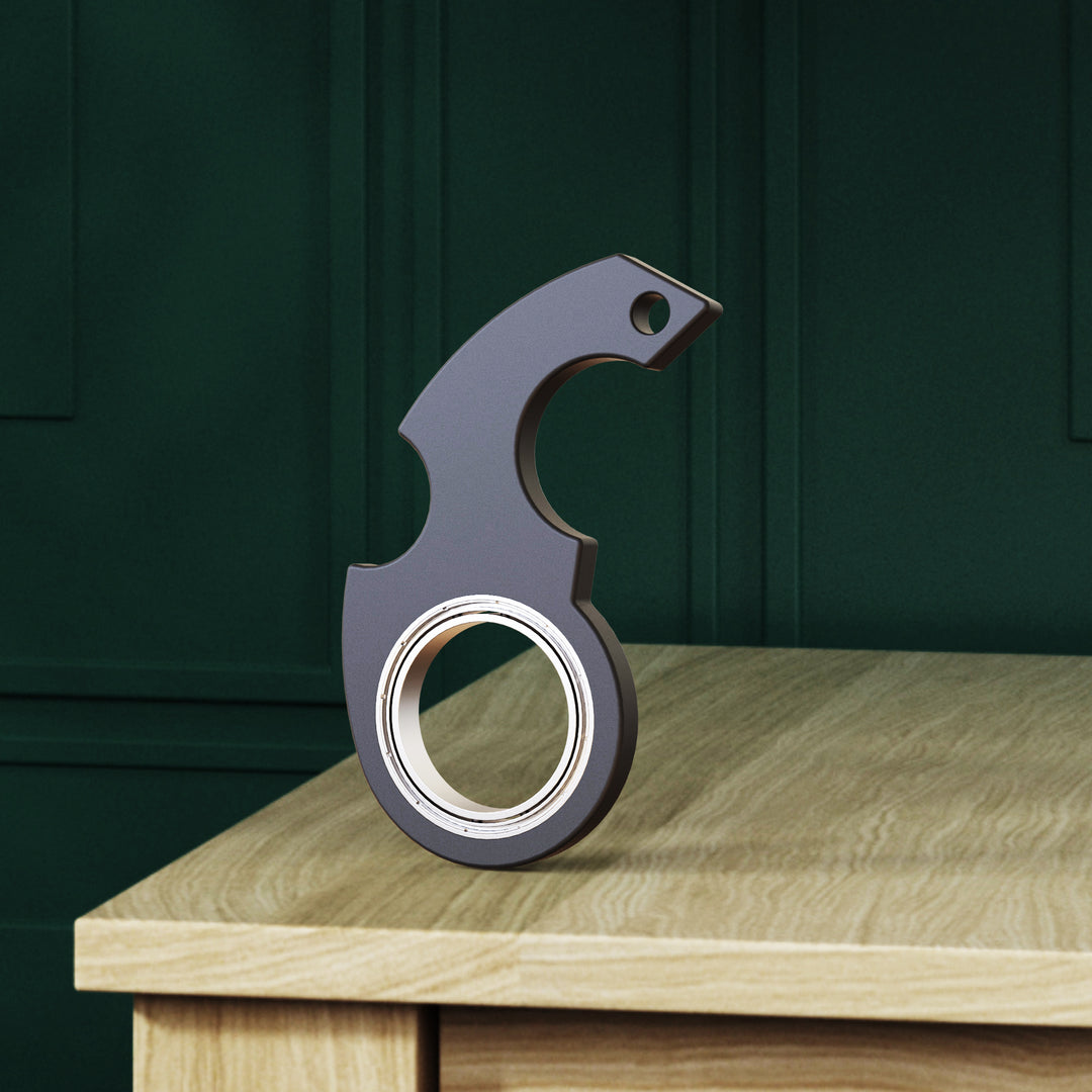 Röd fidget spinner på nyckelring