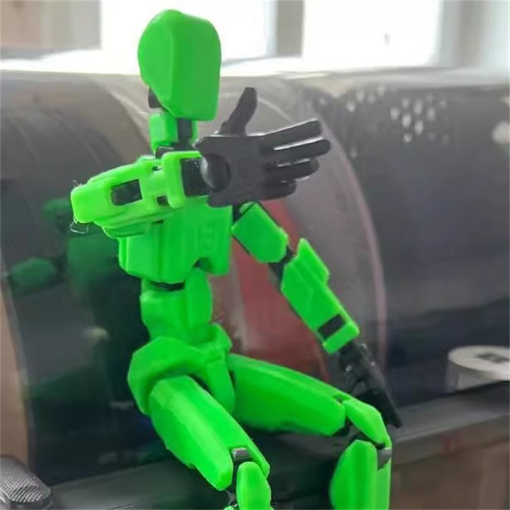 Orange 3D-printad robotfigur i pose