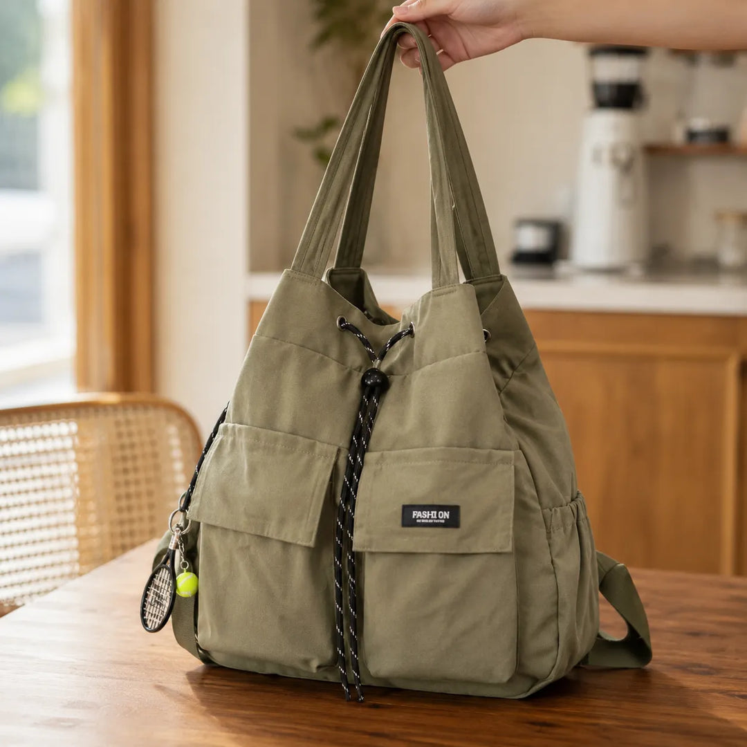 Väska Carryall – Konwertowalna väska z troczkami i plecak z kieszeniami cargo