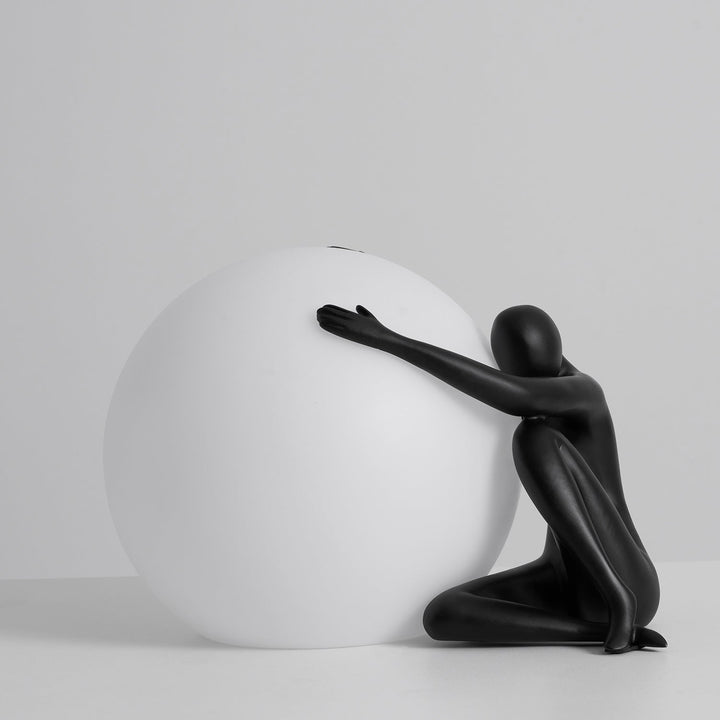 Humanoid Ball Holding Table Lamp