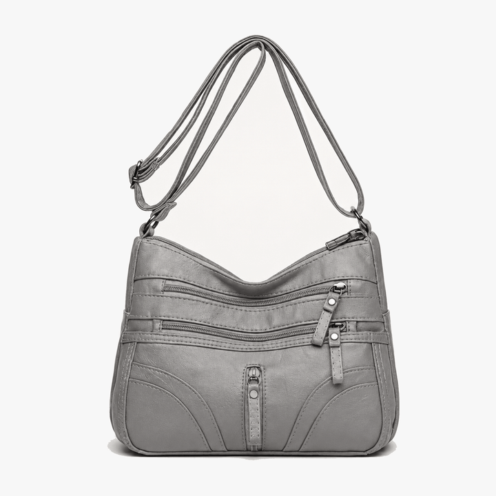 Caressa – Mjuk läder handväska crossbody med flera fickor
