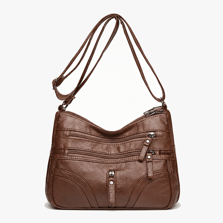 Caressa – Mjuk läder handväska crossbody med flera fickor