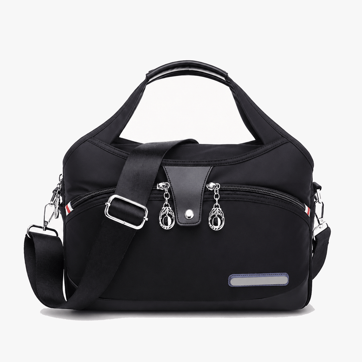 Carryella – Väska över axeln med flera fickor i design przeciwdziałającym kradzieży
