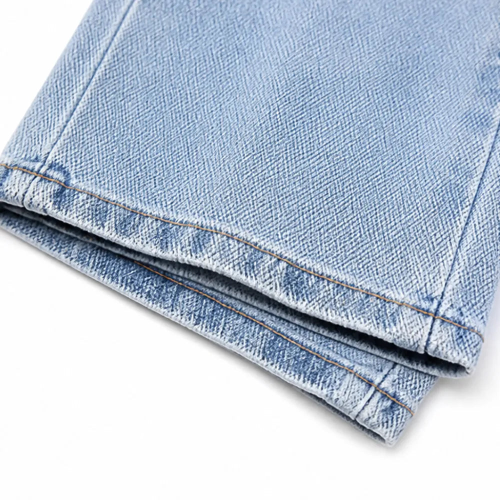 Vellara – Asymetryczne jeans z vida ben i wiązaniem w midja