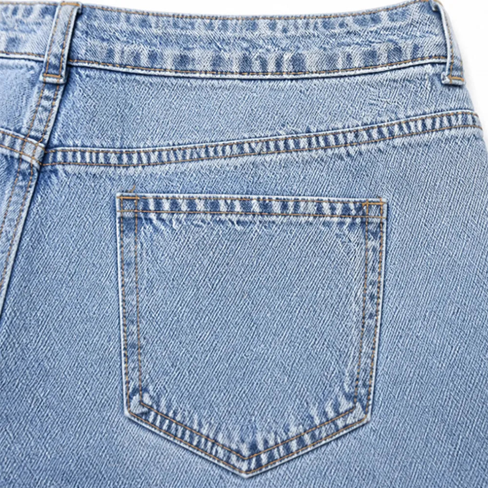 Vellara – Asymetryczne jeans z vida ben i wiązaniem w midja