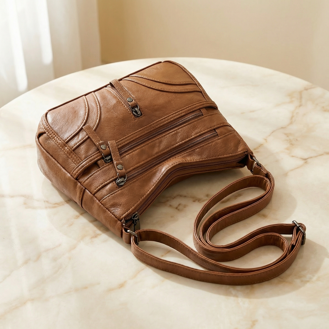 Caressa – Mjuk läder handväska crossbody med flera fickor