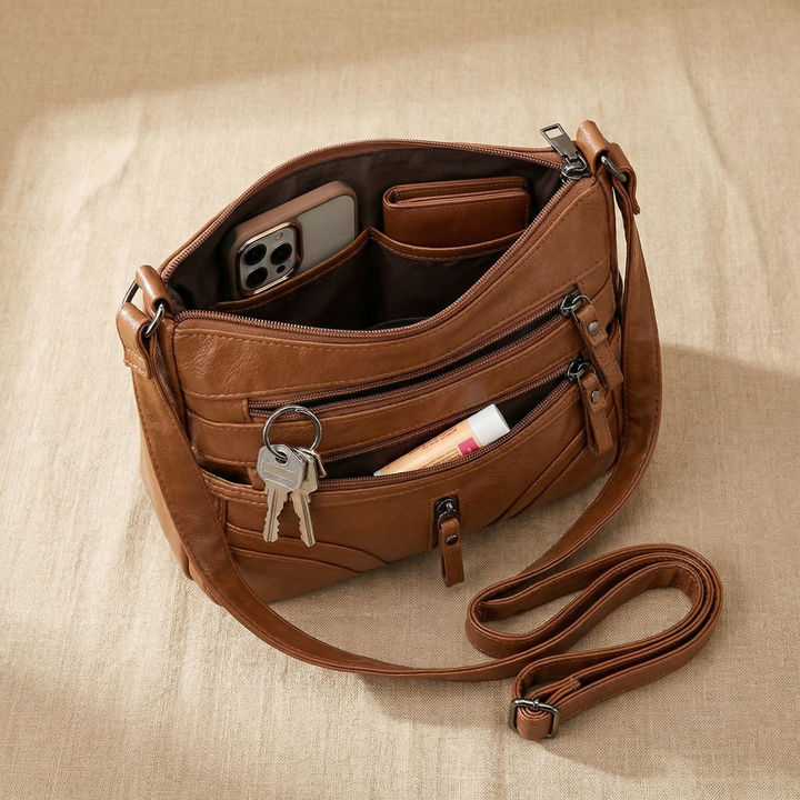 Caressa – Mjuk läder handväska crossbody med flera fickor